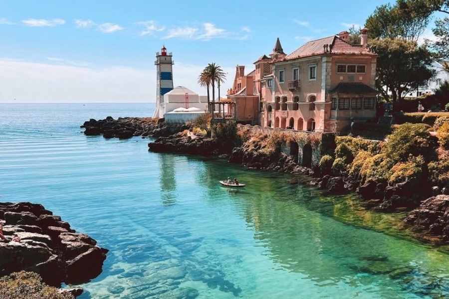 Santa Marta lighthouse and the rocky cove in Cascais
