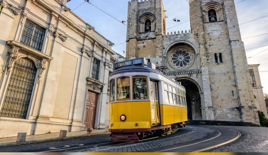 Tram 28 passing the Sé cathedral in Lisbon